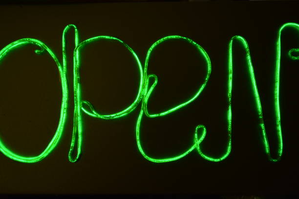 istock Lime green lighting with a specific pattern. Woven filaments, cable, wires with outgoing light. Neon electroluminescent wire with an inscription and letters open. 1155913869