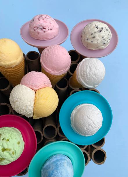 istock Ice cream balls in colorful cones from above 1155918713