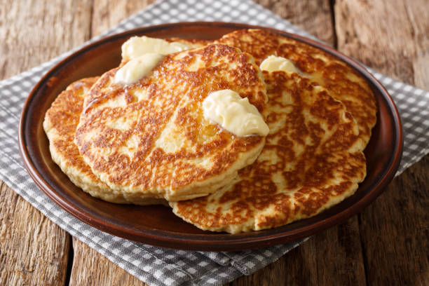 istock Freshly made Sweet Griddle Cakes with butter close up on a plate. horizontal 1155919136