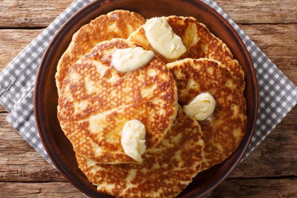 istock Delicious Sweet Griddle Cakes with butter close-up on a plate. Horizontal top view 1155919208