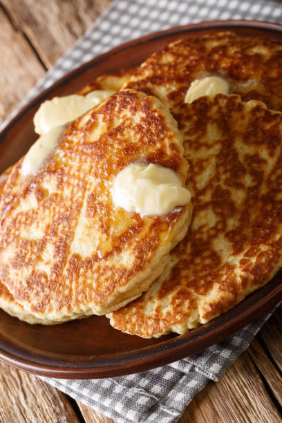 istock Gorditas de Azucar (Sweet Griddle Cakes) with butter close-up on a plate. vertical 1155919724