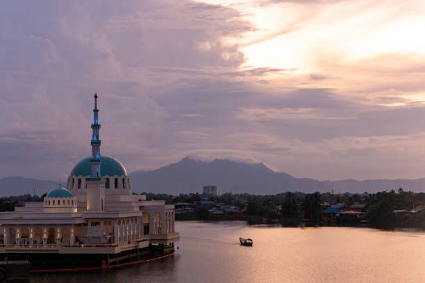 Masjid India Kuching floating moque at sunset Kuching cityscape in Malaysian Borneo kuching waterfront stock pictures, royalty-free photos & images