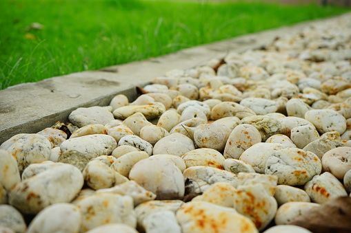 A wall with a small stone texture neatly arranged is suitable as a background