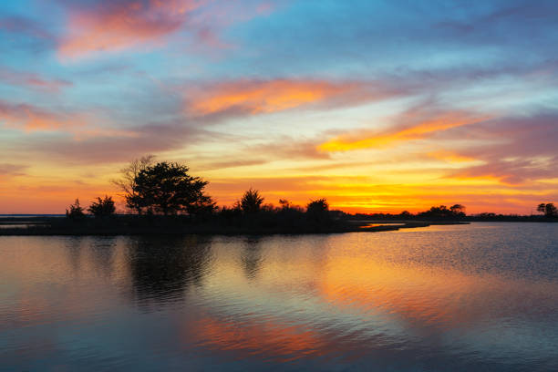 istock Colorful clouds over the bay at Assateague Island 1155924337