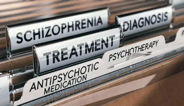 3D illustration of files with schizophrenia diagnosis and treatment with antipsychotic medication and psychotherapy. Mental health conditions concept.