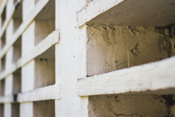 istock Perspective shot of white wall with square holed 1155926881