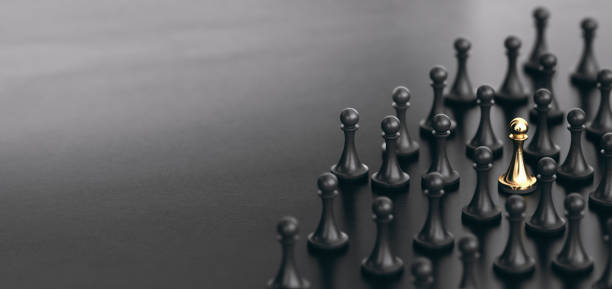 Standing Out From the Crowd. Talent Sourcing. Spotted Candidate 3D illustration of many pawns over black background plus a golden one. Concept of talent sourcing and spotted candidate pawn chess piece photos stock pictures, royalty-free photos & images