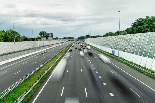 Traffic over the highway, motion blurred traffic, ring east A10, 06/14/2019 Amsterdam the Netherlands, speedway, freeway fast