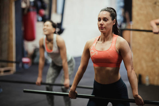 istock Woman Weightlifting 1155930524