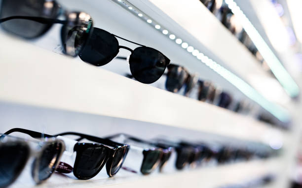 istock Men's sunglasses in a store. 1155930840