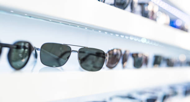 istock Men's sunglasses in a store. 1155930928