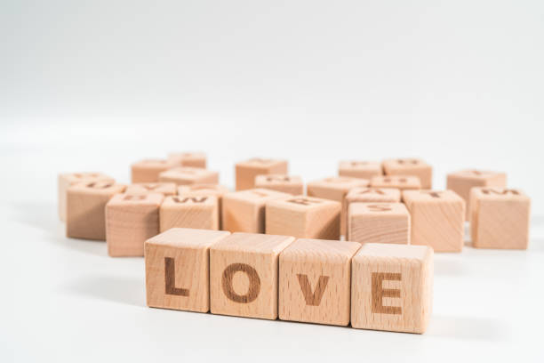 istock word LOVE on wood cube dices on white background. 1155931836