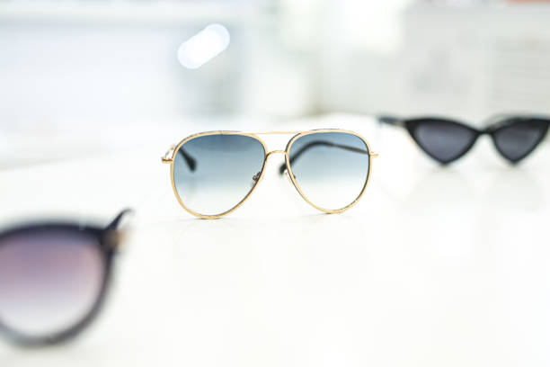 istock Women's sunglasses in a store. 1155933402