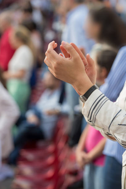 istock Close-up of woman's hands applauding 1155934483