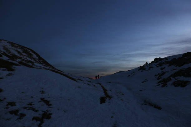 istock Silhouette of a hikes in sunset 1155935271
