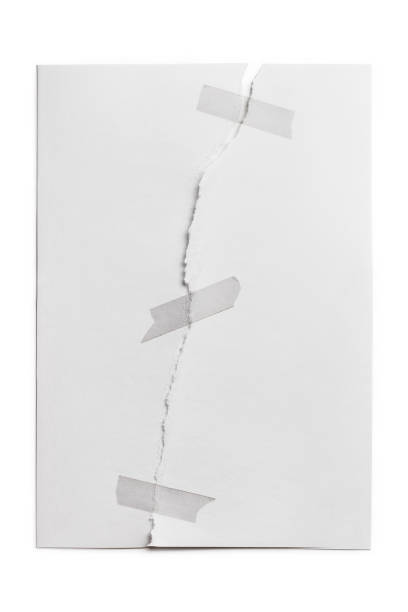 Torn paper on white Sheet of paper, torn in half and glued with adhesive tape, isolated on white background breaking photos stock pictures, royalty-free photos & images