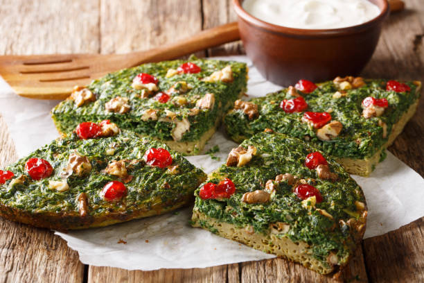 istock Rustic kuku sabzi omelette of herbs, eggs and nuts close-up on the table. horizontal 1155942329