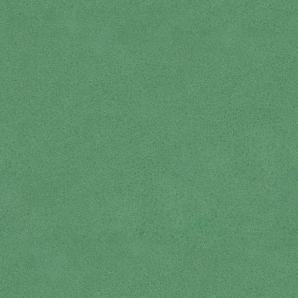 istock Close up of a green leather texture. Seamless square background, tile ready. 1155942932
