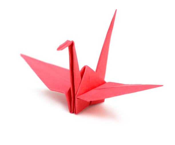 istock red paper crane origami bird isolated 1155943240
