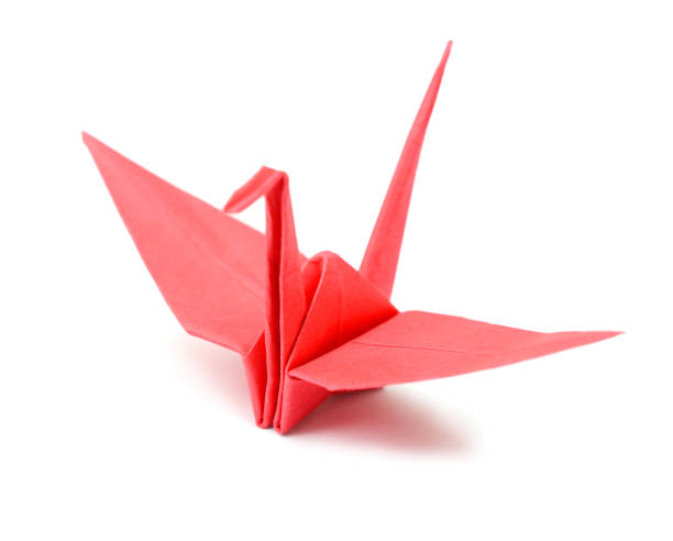 istock A red origami bird on white background 1155943277