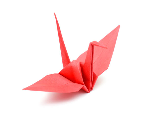 istock Origami crane isolated on a white background 1155943289
