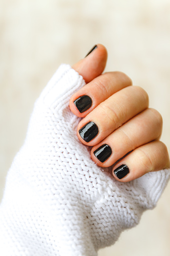 Hand With Black Manicure On Short Nails In A White Sweater On A Light Background The Concept Of A Stylish And Warm Winter Stock Photo - Download Image Now - iStock Hand With Black Manicure On Short Nails In A White Sweater On A Light Background The Concept Of A Stylish And Warm Winter Stock Photo - Download Image Now - iStock