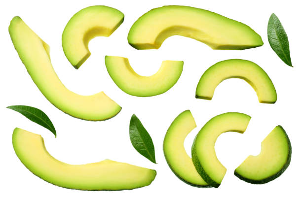 istock sliced avocado with leaves isolated on white background. top view 1155945396