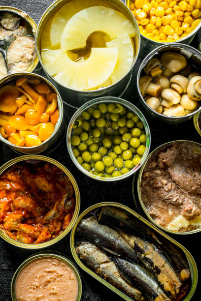 istock Canned food in open cans. 1155945945