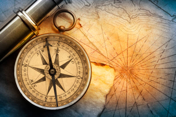 istock Compass And Spyglass On An Old MapCompass And Spyglass On An Old Map 1155945992