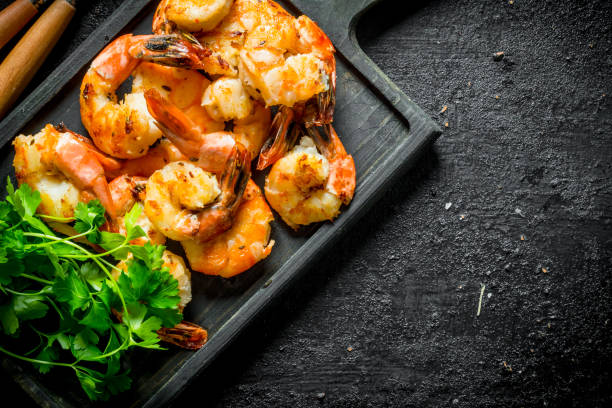 istock Freshly cooked shrimps with parsley. 1155946290