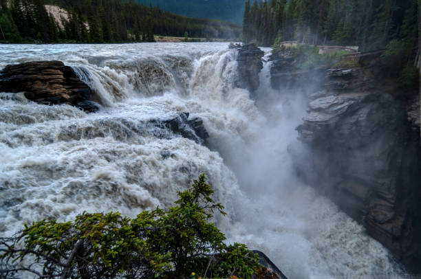 istock river water falling at Athabasca Falls, Jasper National park, Alberta Canada 1155946415