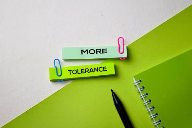istock More Tolerance text on top view office desk table of Business workplace and business objects. 1155947183