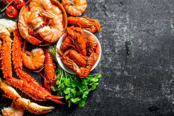 istock Cooked shrimp, crayfish and crab with parsley. 1155947514