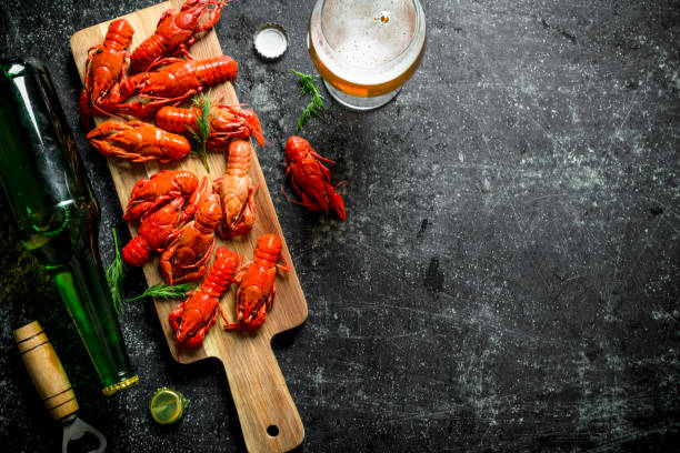 istock Boiled crayfish with a bottle of beer. 1155949469