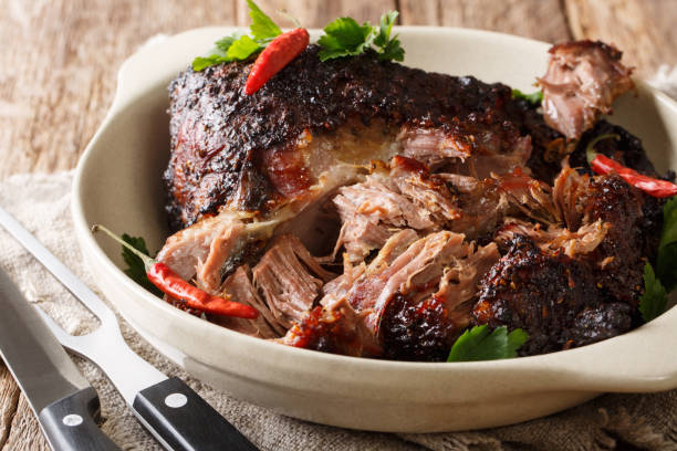 istock Puerto Rican Pernil asado shredded pork close-up on a plate. horizontal 1155951123