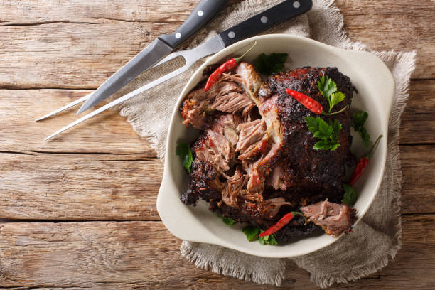 istock pernil asado slow cooked shredded pulled pork close-up on a plate. horizontal top view 1155951532