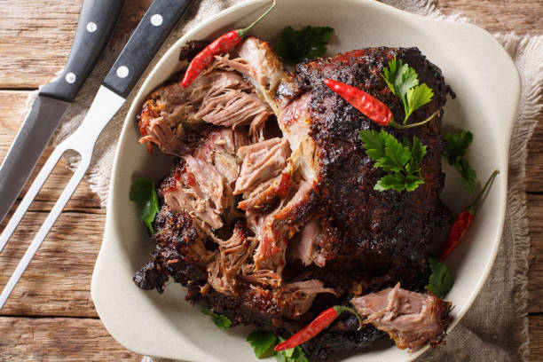 istock Slowly cooked shredded pulled pork close-up on a plate. horizontal top view 1155952116