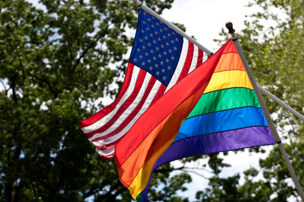 lgbt and american flags together - gay pride flag fotos imagens e fotografias de stock