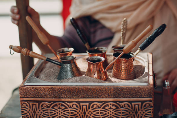 istock Making Turkish Arabic Coffee in the Sand in jezve 1155954703