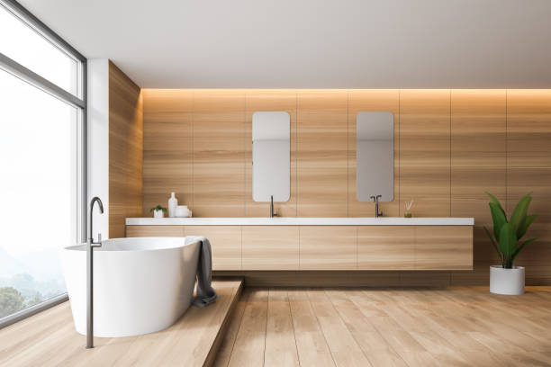 istock Wooden bathroom interior with tub and double sink 1155955918