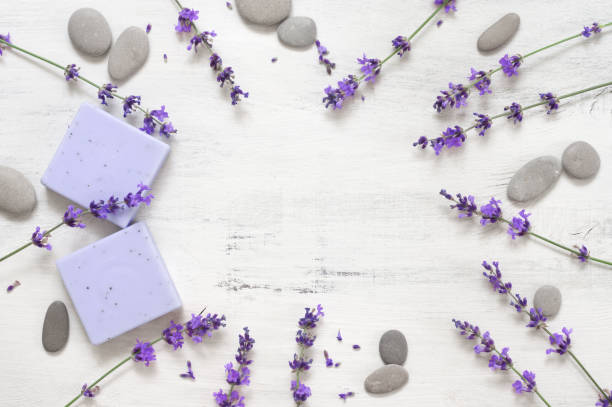 istock Lavender soap and flowers on rustic white wood 1155957072