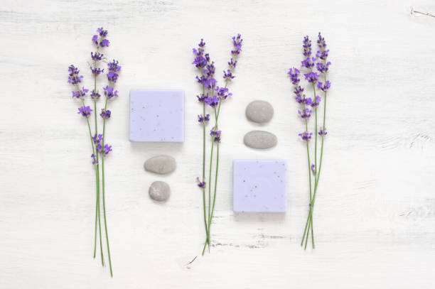 istock Lavender soap and flowers on rustic white wood 1155957078
