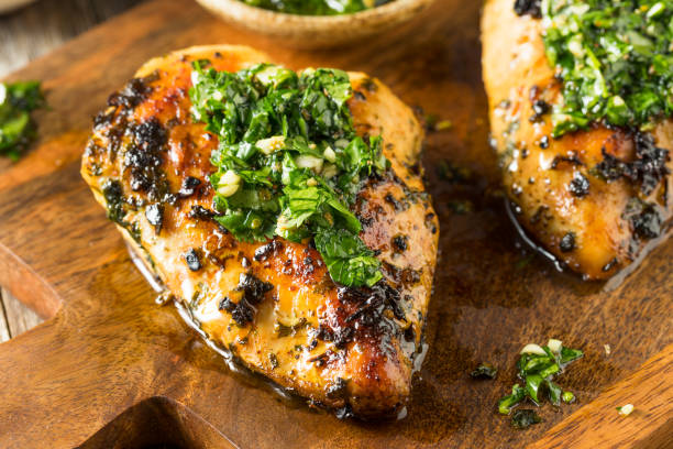 Homemade Grilled Chimichurri Chicken Breast Homemade Grilled Chimichurri Chicken Breast Ready to Eat chicken breast photos stock pictures, royalty-free photos & images