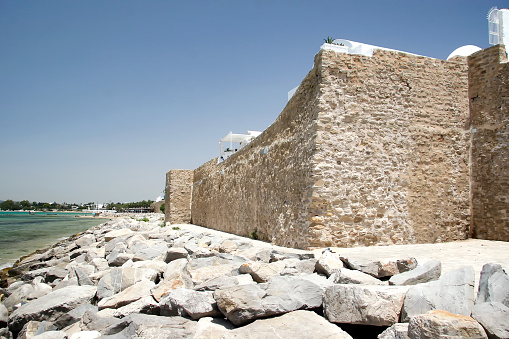 Stone wall of the fortress in Hammamet, on the shores of the Mediterranean Sea. Tunisia