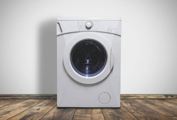 istock Modern washing machine in laundry room interior 1155964297
