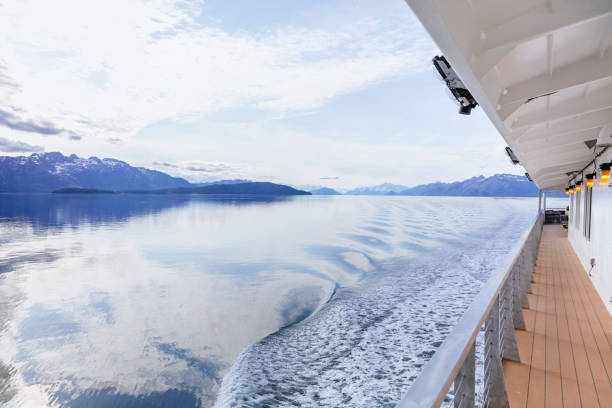 istock Glacier Bay National Park and Preserve landscape with a ship's wake 1155969708
