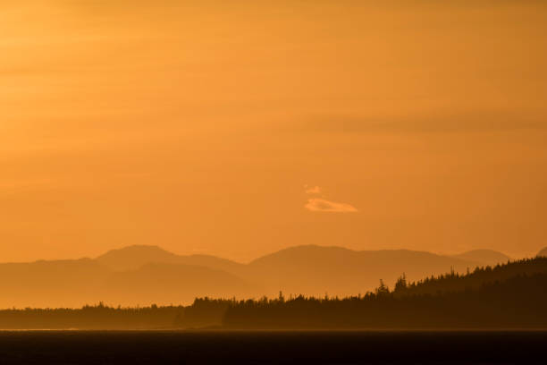 istock Orange sky at sunset in southeast Alaska 1155971186