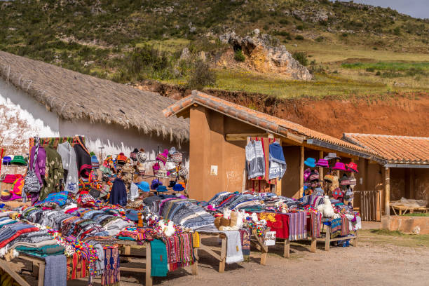 Peruvian selling local products at scenic view site for tourists