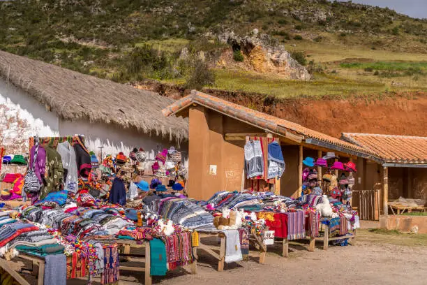 Peruvian selling local products at scenic view site for tourists