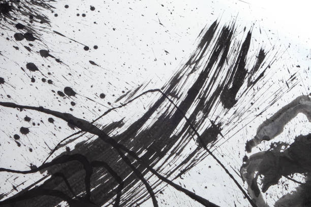 istock grunge black ink Blotches and splats on white paper 1155974685